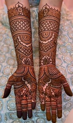 Arabic henna designs are abstract and less dense with designs featuring graceful, usually large, floral and vine patterns on the hands and feet. Indian mehndi involves fine, thin lines for lacy, floral, paisley patterns with lines and dots. Dense patterns cover entire hands, forearms, feet and shins. Lehenga Blouse Designs Latest Bridal, Mehndi Designs Front Hand Heavy, Lehenga Hand Design, Arebic Mahendi Designs Latest Full Hand, Heavy Mehndi Designs Front Hand Palm, Mehendi Designs For Hands Unique Indian Weddings, Heavy Mehandi Designs, Bridal Mehendi Designs Hands Indian Weddings, Traditional Bridal Mehandi