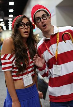 a man and woman dressed up in costumes