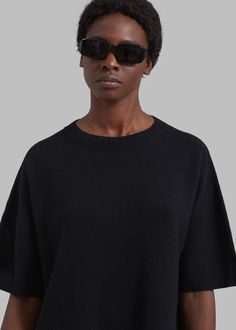 Color: Black Midweight wool blend fabric Oversized fit Crew neckline Drop shoulders Side slits Rib knit trim Slip on style Unlined 50% Superfine Wool 45% Polyamide 5% Cashmere Dry Clean By The Frankie Shop. Imported Black Oversized Chic Knit Top, Oversized Black Chic Knit Top, Black Wool Oversized Sweater, Black Oversized Wool Sweater, Oversized Black Wool Sweater, Oversized Black Knit Top With Crew Neck, Oversized Black Crew Neck Knit Top, Oversized Black Knit Top, Black Knit Top With Ribbed Collar For Fall