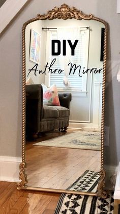 a large mirror sitting on top of a wooden floor