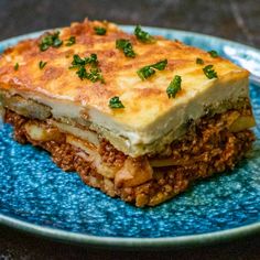 a piece of lasagna on a blue plate