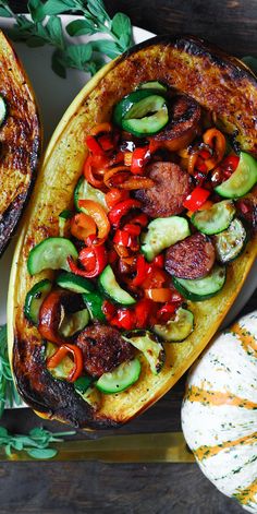 Stuffed Spaghetti Squash with Sausage, Bell Peppers, and Zucchini - on a white platter. Roasted Bell Peppers, Stuffed Spaghetti Squash, Refreshing Beverages, White Platter, Dairy Free Dinner, Spaghetti Squash Recipes, Fall Flavors, Thanksgiving And Christmas, Fall Dinner