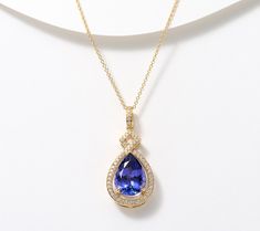 Elevate your accessory game with Pure Tanzanite by Jeff Moseley. This stunning pear-shaped, heat treated tanzanite and diamond pendant on a cable link chain, all set in 18K gold, is sure to capture your heart -- and the attention of jewelry afficionados wherever you go. Get ready for the compliments. From Pure Tanzanite by Jeff Moseley. Pendent Set, Tanzanite Pendant, Tanzanite Necklace, Diamond Pendant, Link Chain, Pear Shaped, Pear, 18k Gold