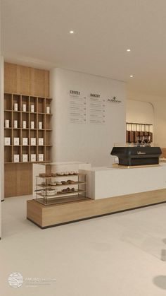 the interior of a bakery with shelves and counter tops