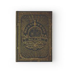 an old book with gold foil on the front and back cover, featuring a sunburst