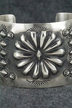 This stunning sterling silver bracelet was made by Navajo silversmith Elvira Bill. The inside is signed Elvira Bill and stamped sterling.Size: 5 7/8" (will fit up to a 7 1/4" wrist)Gap: 1 3/8"Width: 2"Free shipping on all orders! We ship with USPS and always include tracking. All orders ship within a day of payment.Returns are accepted up to 30 days after you receive your order. Just send us a message. Our shop offers cash back or store credit. The item must be returned in new condition. Southwestern Silver Bracelets With Concho, Artisan Sterling Silver Concho Cuff Bracelet, Artisan Silver Concho Cuff Bracelet, Western Jewelry, Sterling Silver Bracelet, Sterling Silver Bracelets, Silver Bracelet, Gap, Stamp