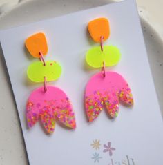 These dangles are so bright, they are 6.5cm long. These resin earrings have been lovingly handmade with resin and a lot of glitter and are a stud  style with a rubber push on  back. Made by hand in small batches and often only one of each.  Due to the handmade nature they may contain some tiny imperfections or bubbles but thats a normal part of the handmade process. No two pieces will ever be identical, they are truly one of a kind.  Thanks so much for your support! These products are handmade in Wagga Wagga ( NSW Australia ) with love and glitter and I'm so happy I get to share them with you. Please note that different monitors and phone screens may represent colours slightly differently. Fun Neon Earrings For Gifts, Vibrant Pink Earrings For Festivals, Colorful Funky Earrings For Party, Funky Yellow Earrings For Party, Funky Handmade Pink Earrings, Funky Pink Handmade Earrings, Resin Things, Wagga Wagga, 80s Vibes