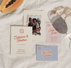 the wedding stationery is laid out on top of paper and other things to put in it