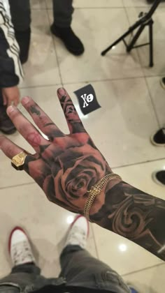 a person with a tattoo on their hand