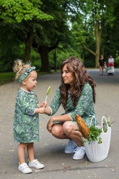 "This set of oversized tunic dresses is ideal for the modern mom and daughter who seek comfort, versatility, and style. This duet will not go unnoticed! The modern palm tree print with bright green colors draws the eye. This mother/ daughter set is perfect for a walk in the park, picnic, movie outing, shopping trip, or get together with friends.  Thanks to its loose style this is also a nice option for expecting mamas.  The beautifully crafted boat neckline with a \"raw\" finish adds stylish charm. The pockets in the side seams are practical and visually appealing. Both mom and daughter get to feel fantastic in this cut. The dresses are sewn from high-quality sweatshirt fabric with a modern palm-themed print.  Weight: 240-250 g/m2 Composition: Dress: 95% cotton, 5% elastan Care: Hand wash; Oversized Tunic Dress, Tunic Dresses, Mother Daughter Dress, Matching Mom, Daughter Mother, Mom And Daughter, Oversized Tunic, Dresses Ideas, Mother And Daughter