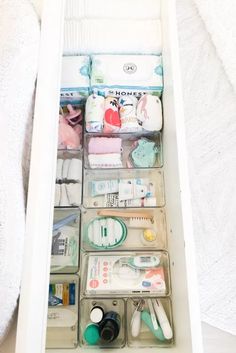 an organized drawer is shown with toothbrushes and other items