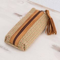 This delightful pencil case will keep your writing tools organized with ease. Alternately the attractive case could be used for cosmetic brushes and tools. Laura Leticia Burrion in Guatemala designs the bag which is woven of cotton on a traditional loom and trimmed with tan leather. The bag is fully lined in polyester and closes with a zipper. Rectangular Pouch With Pen Holders, Rectangular Pencil Case With Pen Holders, Travel Pencil Case With Pen Holders In Beige, Beige Pencil Case With Pen Holders, Rectangular Beige Pencil Case For Everyday Use, Beige Pencil Case With Pen Slots, Beige Pencil Case With Pen Holders As Gift, Rectangular Beige Pencil Case For Daily Use, Rectangular Pencil Case With Pen Slots For Crafting