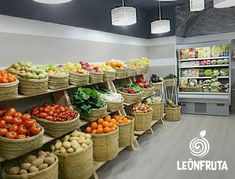 a grocery store filled with lots of fresh fruits and veggies on display in baskets