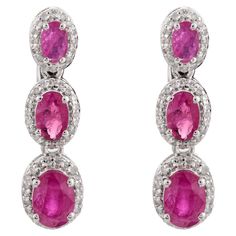 Ruby Halo Diamond Dangle Earrings in 14K Gold to make a statement with your look. You shall need dangle earrings to make a statement with your look. These earrings create a sparkling, luxurious look featuring oval cut ruby. Ruby improves mental strength. Designed with oval cut ruby with halo of diamond in solid gold. This beautiful handcrafted ruby dangle earrings. It can be a Bridal Shower Gift, july birthstone earrings, Valentine's Gift, Gift For Sister, Mother Daughter Gift, Bride To Be Gift, Earrings To Make, Ruby Set, Small Dangle Earrings, Halo Diamond Earrings, Mental Strength, Diamond Dangle Earrings, Gold Gift, Birthstone Earring, Valentine's Gift