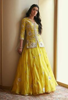 Editor's Note Featuring Yellow Nargis Lehenga Set with Hand Embroidered, French Knots, Aari, Appliques Fabric: Organza Silk Color: Yellow Care: Dry Clean Only About the Designer A melange of ri... Haldi Function, Kurta Lehenga, Function Dresses