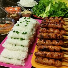 there are many different foods on the trays that have rice and meat in them