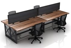 an office desk with two computer screens on top and four black chairs around the desk