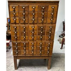 an old wooden dresser with many drawers