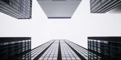 looking up at skyscrapers from the ground