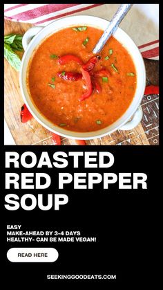 a bowl of roasted red pepper soup on a wooden table