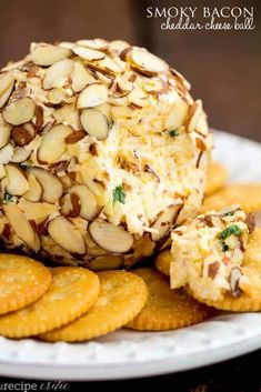 a plate with crackers and cheese ball on it