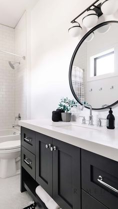 white counter, round mirror, black mirror, black cupboards, black cabinets, silver appliances, silver faucet, silver handles, round lights, bathroom inspo, home decor, interior design, dream home, Chrome And Black Bathroom, Black Cupboards, Black And Chrome Bathroom, Chrome Bathroom Fixtures, Black And Silver Bathroom, Black Bathroom Fixtures, Silver Faucet, Springville Utah