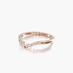 a rose gold ring with three diamonds