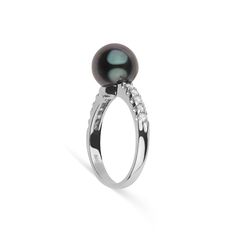 This 9.0-10. mm AAA quality Tahitian pearl ring showcases the pure organic beauty of an exotic Tahitian pearl. The flawless pearl appears to float above the gold, yet is securely attached by a strong post. The classic-style ring features a solid 14-karat gold band that is set with 0.25 carats of diamonds. The ring setting is made in-house and is composed of solid 14 karat gold. We use an extra-fine diamond grade (VS1-G), which is normally reserved for solitaire settings. It's rare to see this gr Classic Tahitian Pearl Ring For Anniversary, Classic White Gold Tahitian Pearl Rings, Elegant White Gold Tahitian Pearl Ring, White Gold Tahitian Pearl Rings For Formal Occasions, Formal White Gold Rings With Tahitian Pearl, Classic Tahitian Pearl Ring For Formal Occasions, Formal White Gold Tahitian Pearl Rings, Elegant Tahitian Pearl Ring Gift, Black Tahitian Pearl Ring