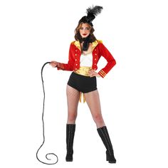 a woman in a circus outfit is holding a rope