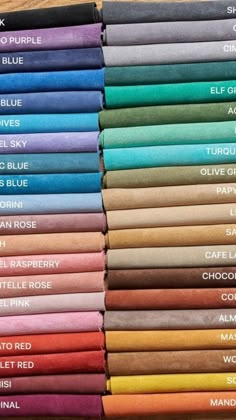 many different colored sheets are stacked on top of each other with the names of them