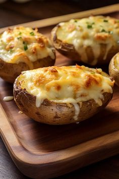 baked potatoes with cheese and herbs on a wooden cutting board, ready to be eaten