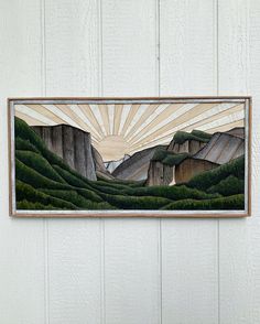 a painting hanging on the side of a wall