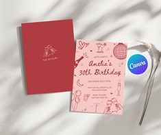 a pink and red birthday card next to a pair of scissors