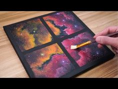 someone is painting the outer part of a space scene with colored chalks and watercolor pencils