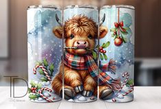 three christmas themed tumbles with a brown teddy bear wearing a scarf and holding a candy cane