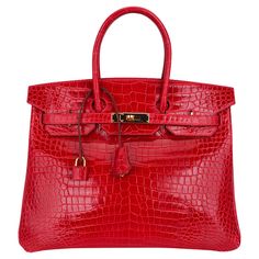 Mightychic offers an Hermes Birkin 35 coveted rare Braise fire engine lipstick red bag. Porosus Crocodile is the most rare and exclusive Hermes skin. The most beautiful small scales. Rarely produced this exquisite Hermes red crocodile Birkin bag is a must have for any Hermes aficionado. Braise is among the most collectible colours. This beauty is lush with Hermes Birkin gold hardware. There are a few light marks on the bag, please do see images. Comes with lock, keys, clochette and sleepers. final sale BAG MEASURES: LENGTH 35 cm / 14" TALL 28 cm / 11" DEEP 18 cm / 7" HANDLES: TALL 5" CONDITION: EXCELLENT Hermes Birkin Handbags, Crocodile Bags, Handbag Heaven, Beautiful Handbags, Hermes Handbags, Bougainvillea, Hermes Bags, Hermes Birkin, Beautiful Bags