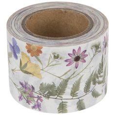 a roll of white floral washi tape with purple, yellow and orange flowers on it