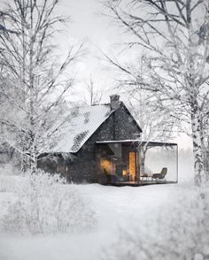 the house is surrounded by trees and snow