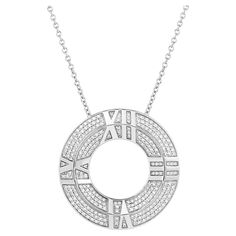 This exquisite Tiffany & Co. pendant showcases the iconic Atlas motif. Crafted in 18 karat white gold, the pendant features a Roman numeral, symbolizing time and eternity. The addition of sparkling diamonds adds a touch of luxury and glamour to this timeless piece. This 18kyg pendant features approximately 0.57 carat with F-G color and VS clarity. Stamped: "© Tiffany & Co. AU 750 Italy d 0.57ct" Luxury Brilliant Cut Initial Pendant Necklaces, Luxury Brilliant Cut Initial Pendant Necklace, Diamond Pendant Tiffany & Co., Pendant Jewelry Tiffany & Co., Gold Pendant Necklace Tiffany & Co., Chain Diamond, Roman Numeral, Roman Numerals, Sparkle Diamonds