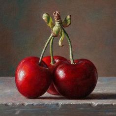 a painting of two cherries on a table with one figurine sitting on top