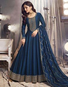 💙 Mesmerizing blue hue for graceful elegance 💙 Flowing anarkali silhouette for a regal look 💙 Intricate detailing and exquisite craftsmanship 💙 Semi-stitched design for a customized fit 💙 Radiates sophistication and charm 💙 Ideal for special occasions and celebrations #BlueDianneSuit #AnarkaliSalwarKameez #PantStyleEnsemble #ArabicAttire #GracefulElegance #TimelessBeauty #RegalVibes #ContemporaryTwist #ImpeccableCraftsmanship #SpecialOccasionWear #FashionInspiration #ExpressYourElegance Nidhi Shah, Anarkali Frock, Designer Dupatta, Silk Anarkali Suits, Celana Fashion, Full Gown, Silk Anarkali, Gown Suit, Salwar Dress