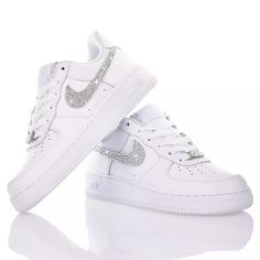 Nike Air Force 1 Swarovski, a cascade of rhinestones covers the "swoosh" of Nike's most iconic sneaker, making it unique, sparkling, and special. Nike Swarovski is also available in junior and baby models. | Mimanera Women's White Swarovski Nike Air Force 1 | SS24 Luxury Embellished Sneakers For Streetwear, Luxury White Custom Sneakers With Rhinestones, Luxury White Sneakers With Rhinestones, Low-top Crystal Embellished Sneakers For Streetwear, Crystal Embellished Low-top Sneakers For Streetwear, Iced Out Low-top Sneakers For Streetwear, Luxury Bedazzled Low-top Sneakers, Luxury Embellished White Sneakers, Luxury Sneakers With Rhinestones And Round Toe