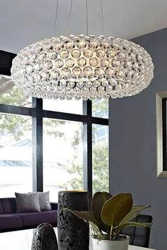 The Caboche Pendant Light by Mooijane is a charming lighting solution that will add a touch of luxury to any space. This unique design features a clear acrylic sphere with sparkling crystals embedded inside, creating a stunning, sparkling effect. It is perfect for any room and will bring elegance and sophistication to your dining room, living room, or bedroom.