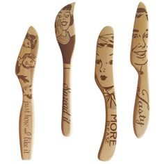 three wooden spoons with designs on them and one has a woman's face