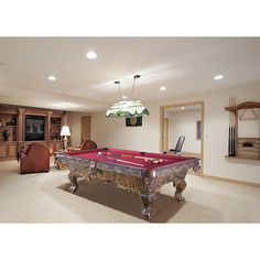 a pool table in the middle of a living room with two lamps on either side