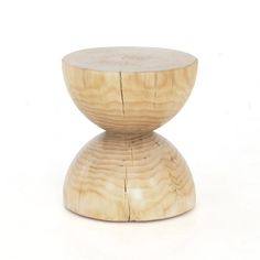 a wooden stool sitting on top of a white floor