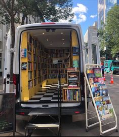 the back end of a van filled with books