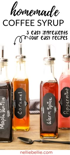 three homemade coffee syrups in glass bottles with chalkboard labels and spoon on the side