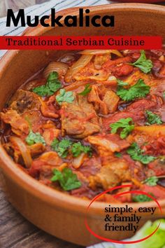 a wooden bowl filled with meat and vegetables