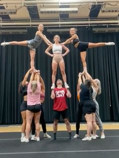 a group of women standing on top of each other